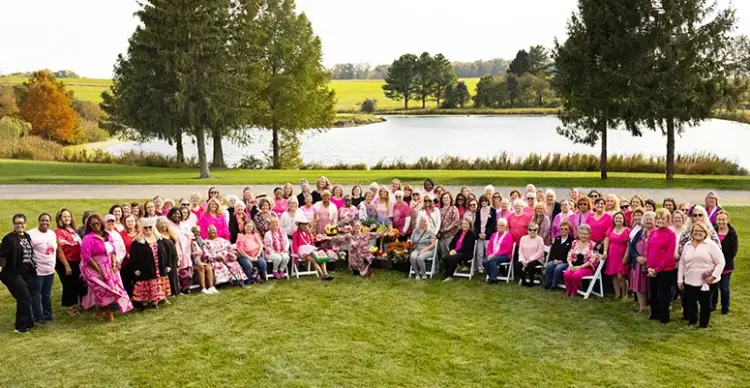 2025 survivors picture feature image - Carroll News | Carroll Publications | Carroll County, MD About 100 survivors were honored at Pink Fling presented by Advanced Radiology with Dr. Dona Hobart wrapping her arms around each one.