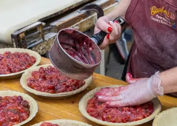 Baugher’s Dottie Baugher Dunn and Sharon Kinser prepare cherry pies.