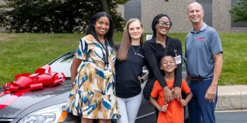 Carroll Community College family who received vehicle through the College’s ongoing partnership with Vehicles for Change.