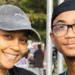 Carroll County walk - Carroll News | Carroll Publications | Carroll County, MD Two smiling people posing together at an outdoor event, wearing bead necklaces and casual clothing.