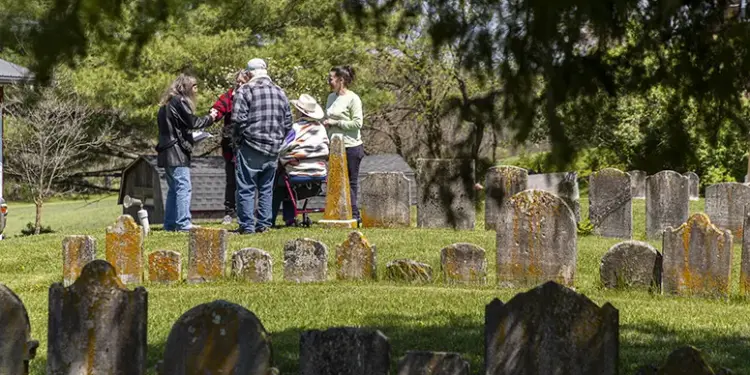 The Sullivan family meets at the Jerusalem Lutheran Church cemetery after researching their family roots.