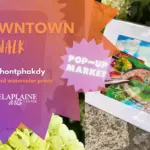Poster for Downtown Artwalk advertising jewelry and watercolor prints, with a pink 'Pop-Up Market' badge and a framed painting beside greenery.