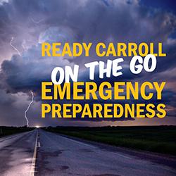 Title card for an emergency preparedness resource: 'Ready Carroll On The Go' with a stormy sky and open road in the background.