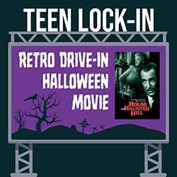 Billboard-style sign promoting a Teen Lock-In Retro Drive-In Halloween Movie, featuring a haunted-house silhouette and a 'House on Haunted Hill' poster.