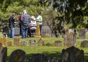 The Sullivan family meets at the Jerusalem Lutheran Church cemetery after researching their family roots.