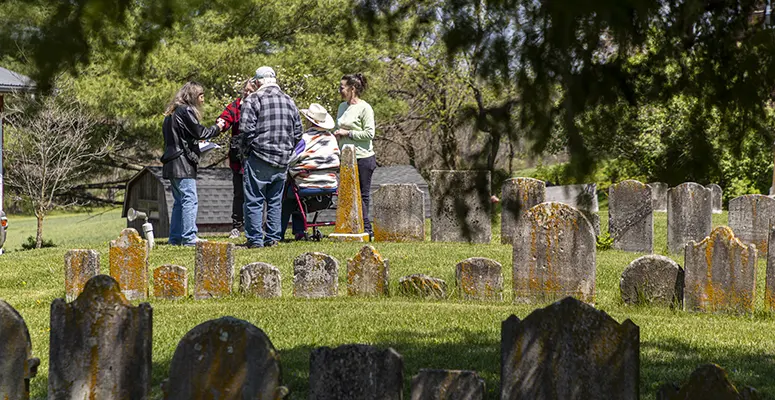 The Sullivan family meets at the Jerusalem Lutheran Church cemetery after researching their family roots.
